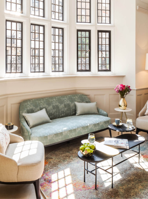 Interior image of one sofa and three chairs at The Evewell Fertility Clinic