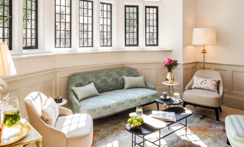 Interior image of one sofa and three chairs at The Evewell Fertility Clinic