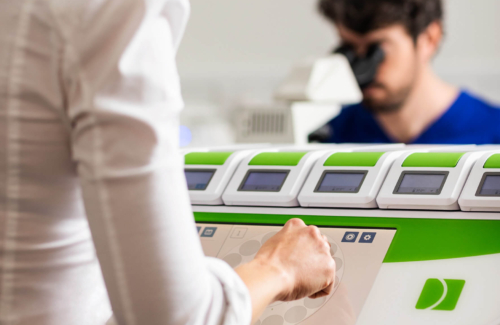 Embryologists looking at embryo samples for ICSI in the Evewell laboratory