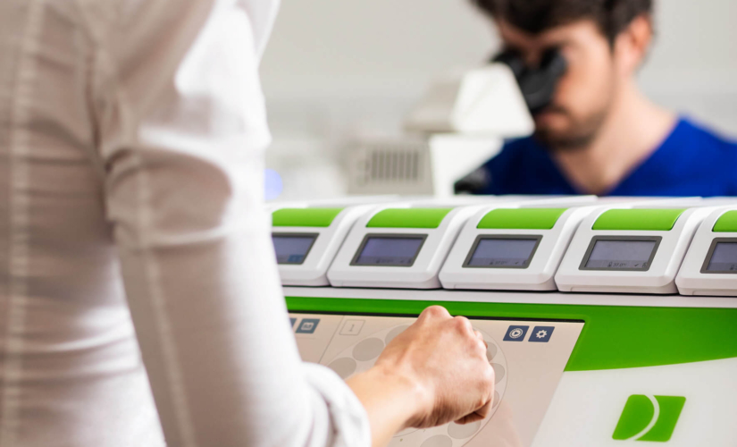 Embryologists looking at embryo samples for ICSI in the Evewell laboratory