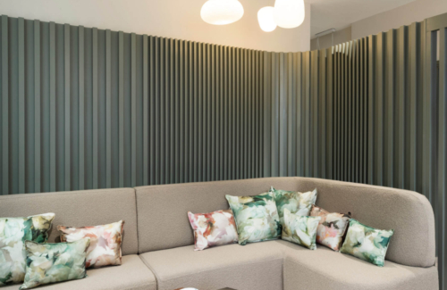 Interior of the Evewell Fertility clinic showing two sofas with cushions