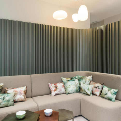 Interior of the Evewell Fertility clinic showing two sofas with cushions