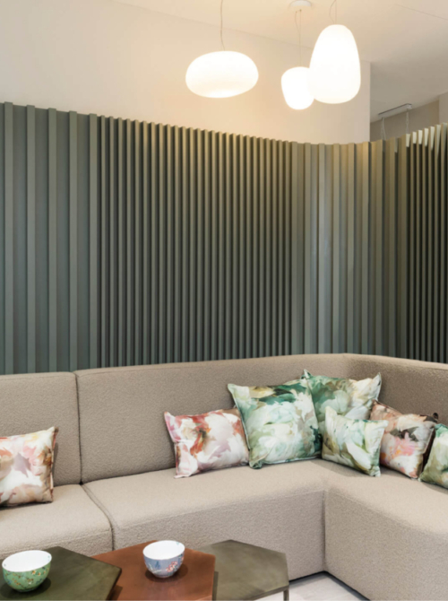 Interior of the Evewell Fertility clinic showing two sofas with cushions