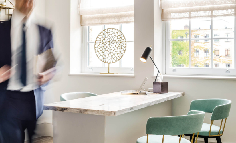 Consulting room interior showing a desk and two chairs at the Fertility Clinic